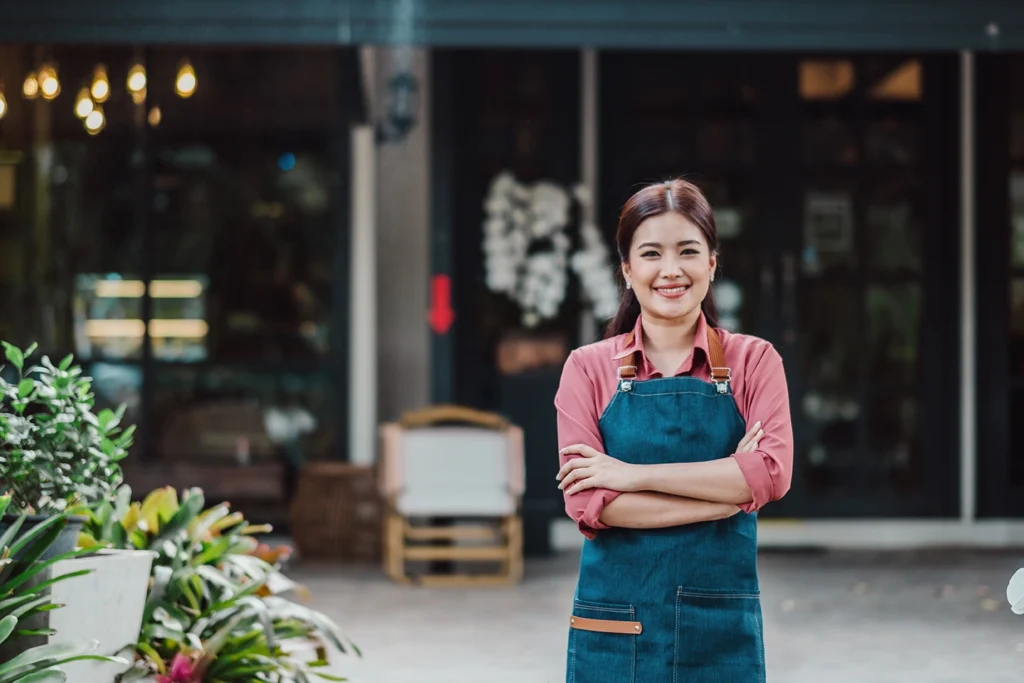 Female Merchant in front of cafe